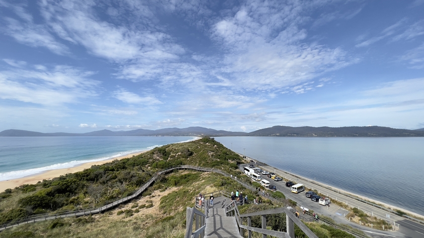 Panoramic view from a lookout showing both ocean and bay.