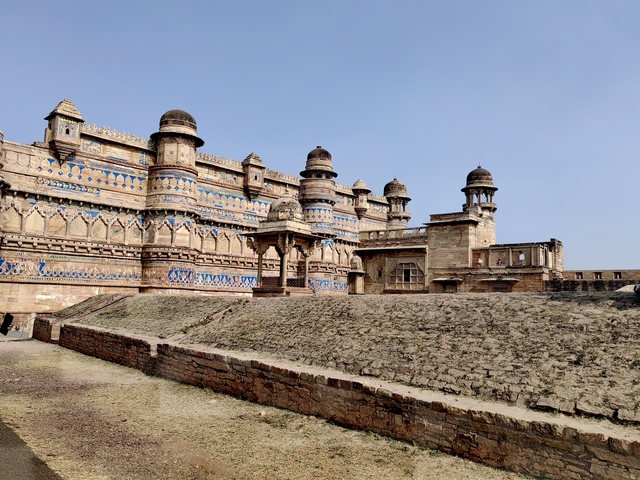 Ancient fort with blue and sandstone architecture.