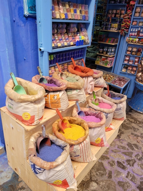 Colorful pigments in bags at a traditional market.