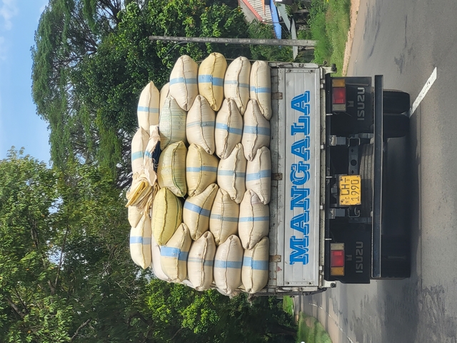       A bundle of sacks on the back of a truck.
  