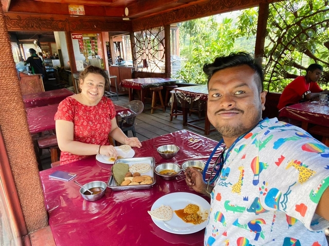       Two people enjoying a meal at a local eatery.
  