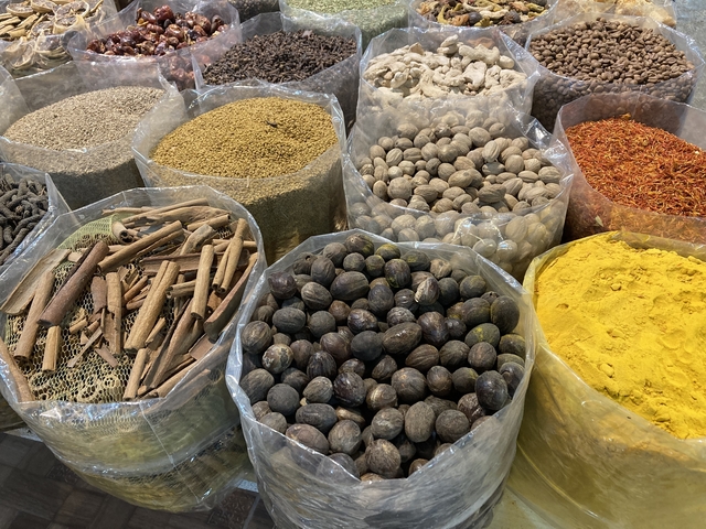 Various spices displayed in bags at a market.