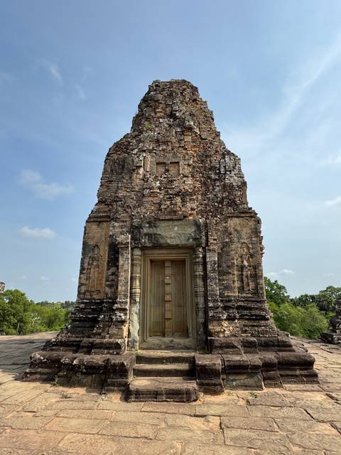 Tall stone structure with visible historical carvings.
