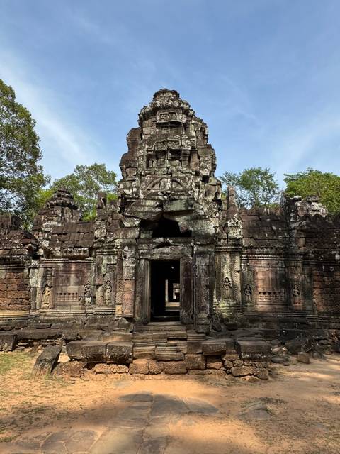 Entrance to an ancient stone structure with detailed carvings.