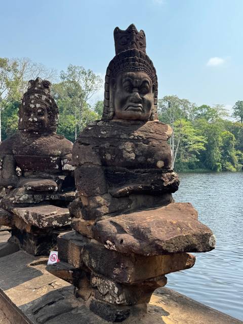 Stone sculpture of a face at an ancient site.