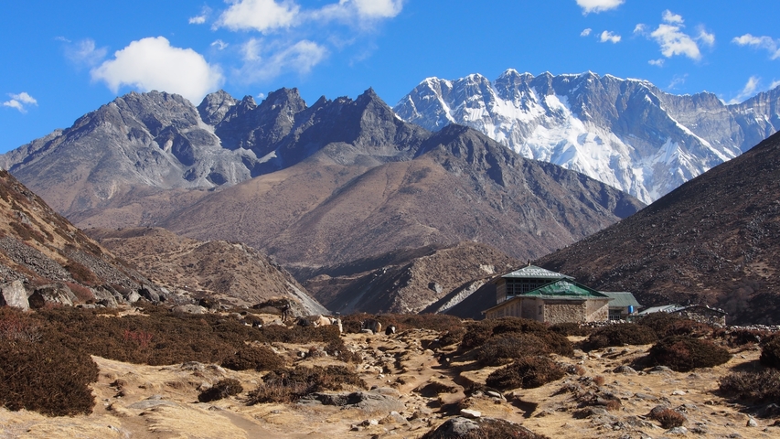       A scenic landscape with rugged terrain and mountains.
  