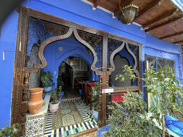 Ornate blue painted entrance with intricate designs.
