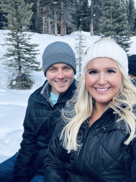      Close-up portrait of a couple in a snowy landscape.
  
