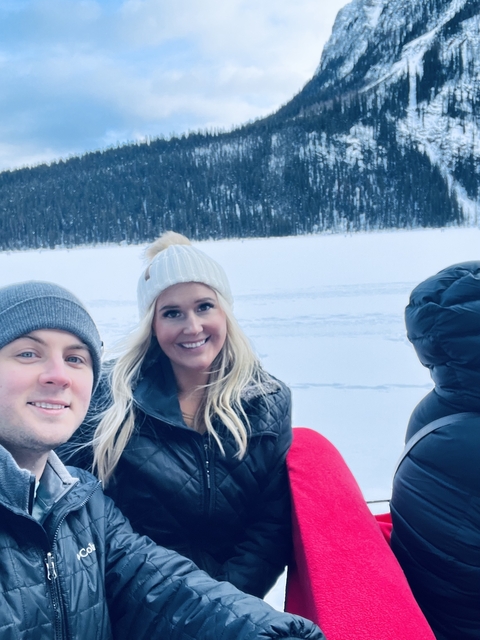       Close-up portrait of two people in a snowy setting.
  