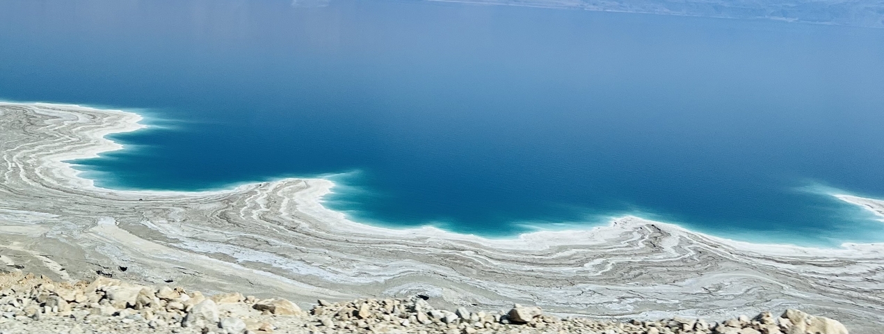       Aerial view of a coastline with salt formations.
  