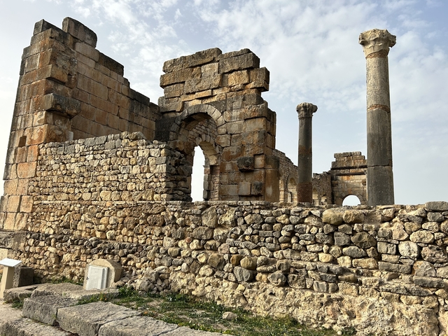       Well-preserved ancient ruins with stone walls and pillars.
  