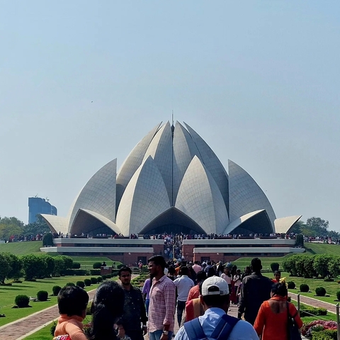 The Lotus Temple with a large crowd of visitors.