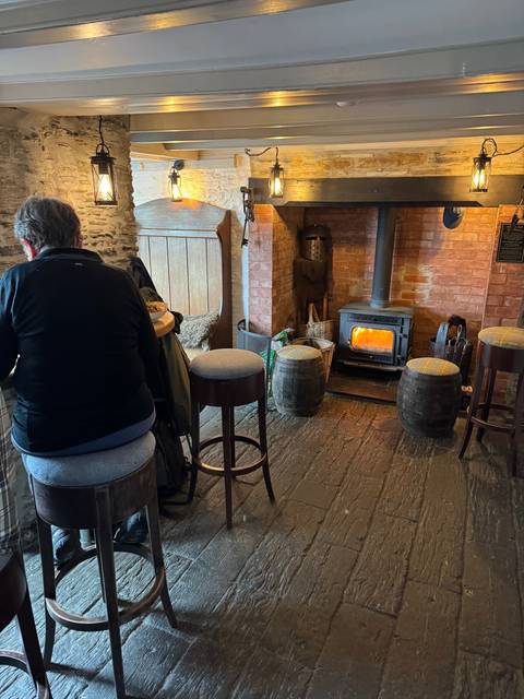 Cozy interior with a fireplace and seating.