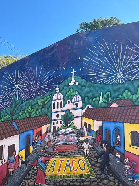 Colorful mural with motifs and fireworks.