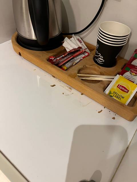      Close-up of a tea tray with stains.
  