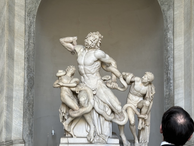 Famous ancient sculpture displayed indoors.