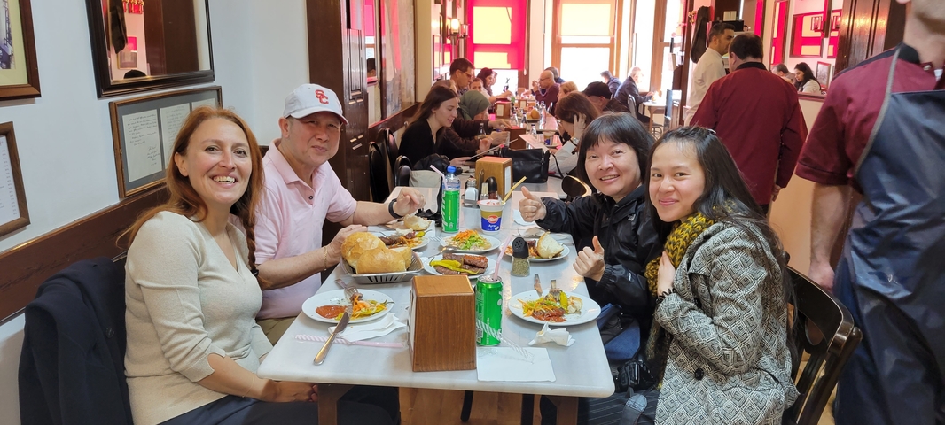 People dining at a bustling restaurant.