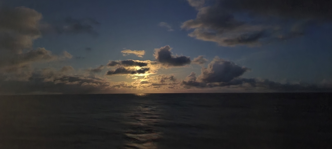 Ocean view with clouds at sunset.