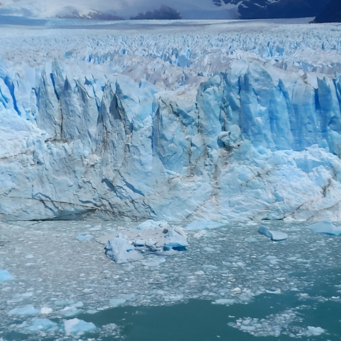       Close-up of a glacier with ice formations.
  