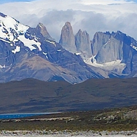      Blurry image of mountains with distinct rock formations.
  