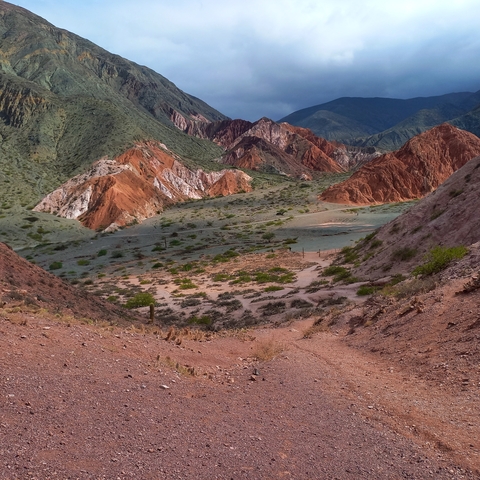       Colorful mountainous terrain with distinct rock formations.
  
