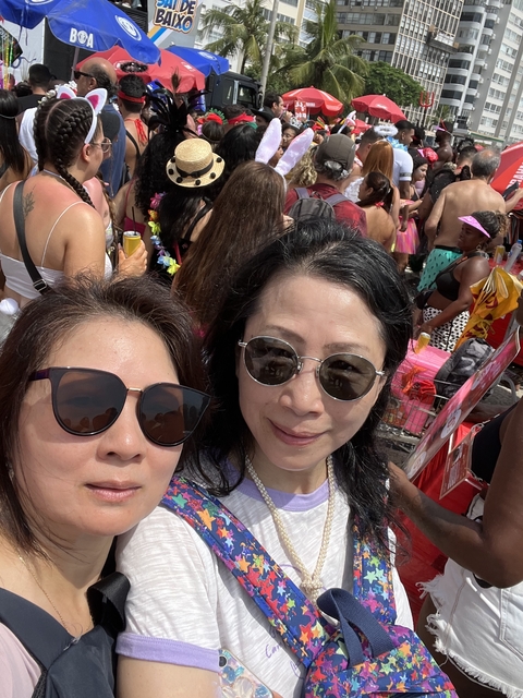      Crowd of people at an outdoor event.
  