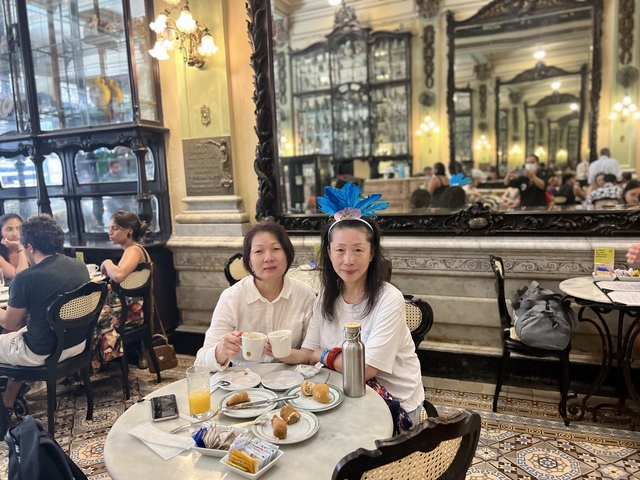       Women enjoying breakfast in a cozy café.
  