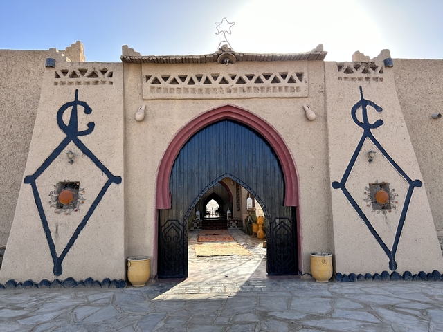 Entryway of a traditional building with ornate decorations.