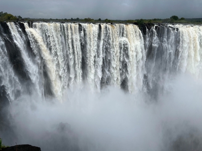 Victoria Falls with mist rising.