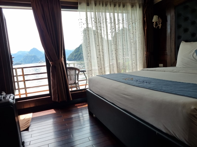 Luxurious hotel room with a balcony view of the bay.