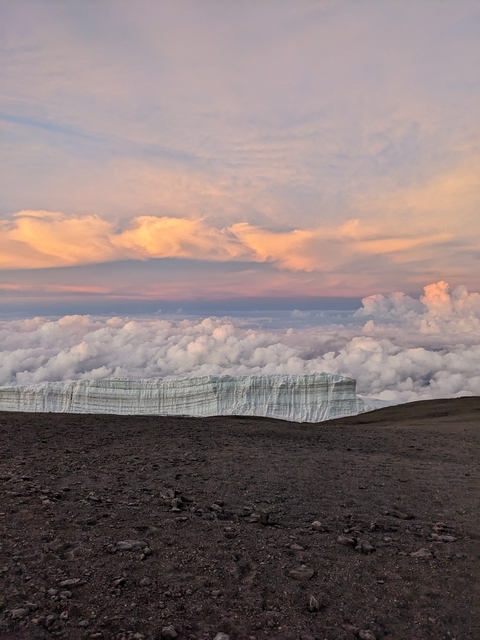 Ice formations and clouds with colorful sky.