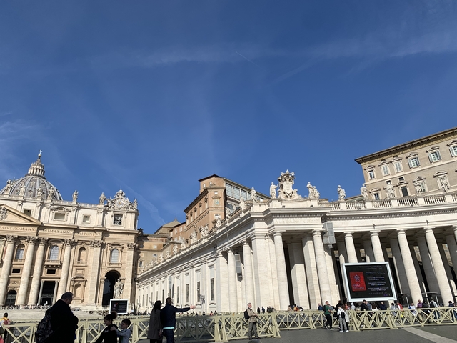 St. Peter's Basilica and square under a clear blue sky.