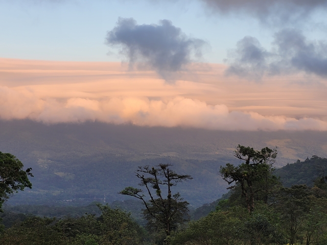 Clouds over a mountainous landscape.