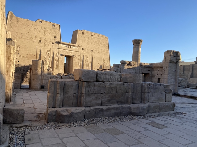       Entrance to a historic temple complex with ancient carvings.
  