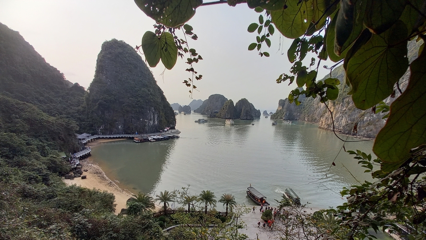 Halong Bay during the day with unique islands and boats.