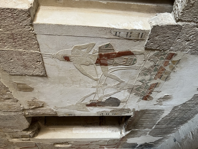       Ancient stone carving of a chariot.
  