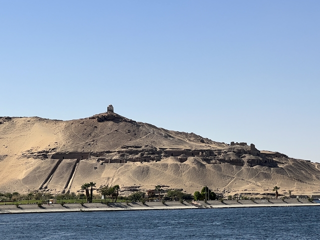       Mountainous landscape with ancient structures.
  