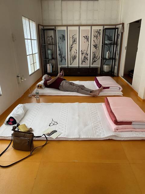       Interior of a traditional Korean building with mats and decor.
  