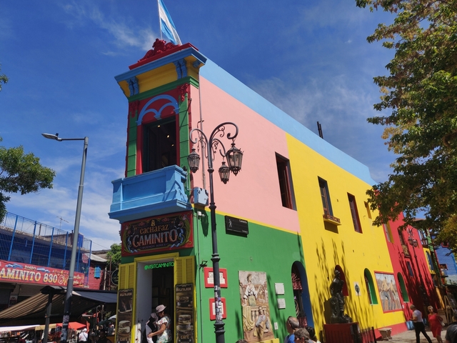 Colorful building with vivid paint and signs.