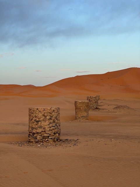Desert landscape with isolated rock formations.