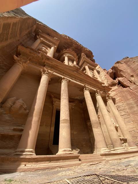 Ancient ruins of Petra with ornate columns.