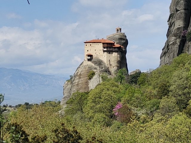      Monastery on a rocky hilltop.
  