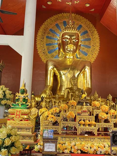 Golden Buddha statue with ornate decorations.