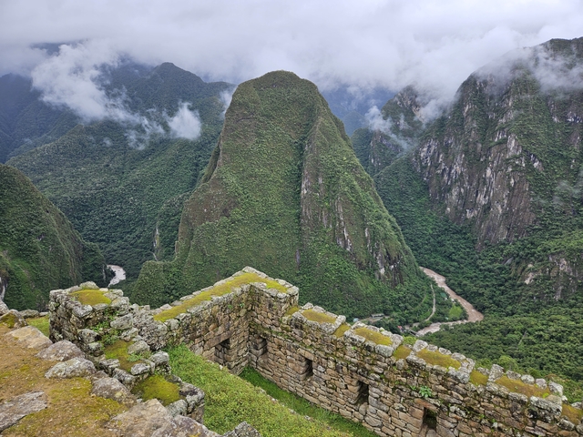 A scenic view of Machu Picchu ruins with mountain backdrop.