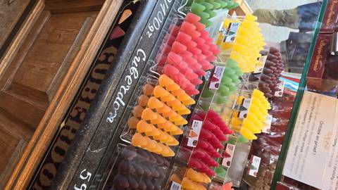       Colorful candy in a display case.
  