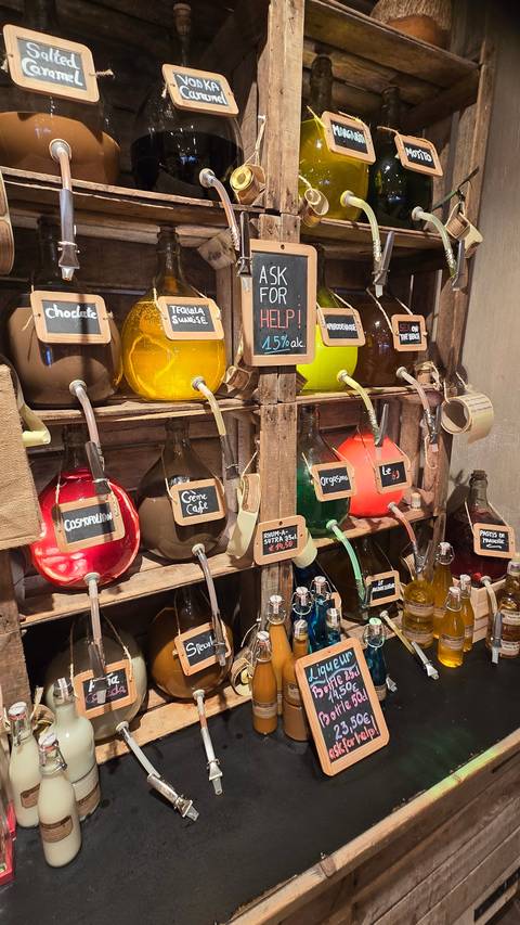       Colorful bottles displayed on shelves.
  
