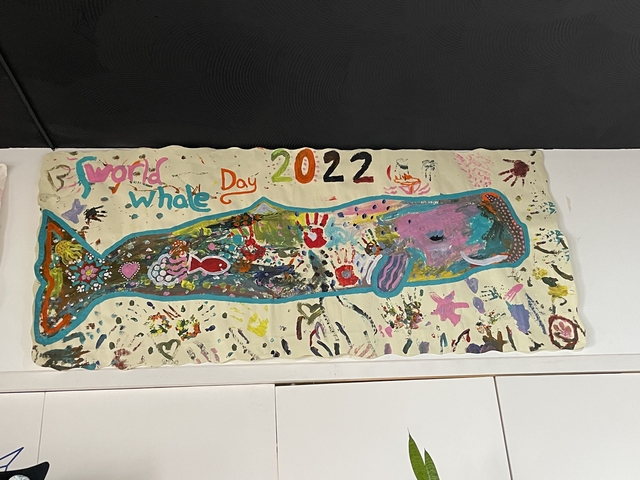       Whale-themed artwork with a date of 2022.
  