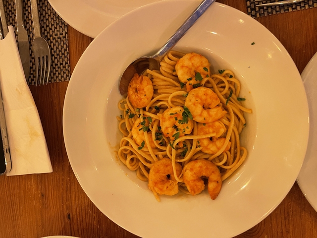 Dish with shrimp and spaghetti.