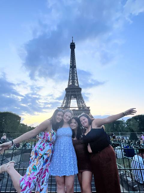 Group of friends with the Eiffel Tower in the background.