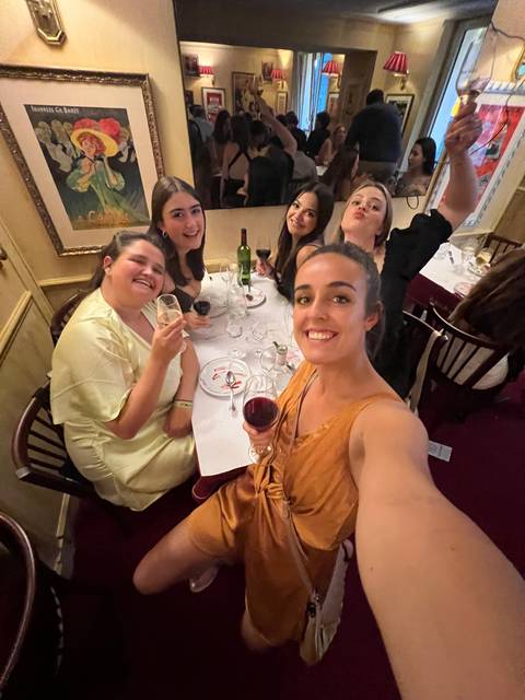 Dining event with a group of friends, seated indoors.